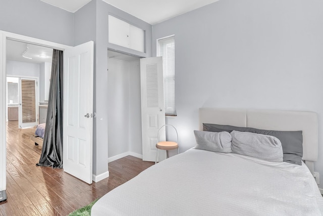 294 Barrow St Unit 6, Jersey City, NJ 07302 - bedroom featuring dark wood-style flooring and baseboards