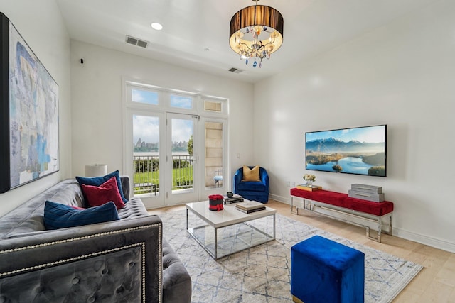 7400 River Rd Unit 114, North Bergen, NJ 07047 - living room with wood finished floors, a chandelier, and recessed lighting