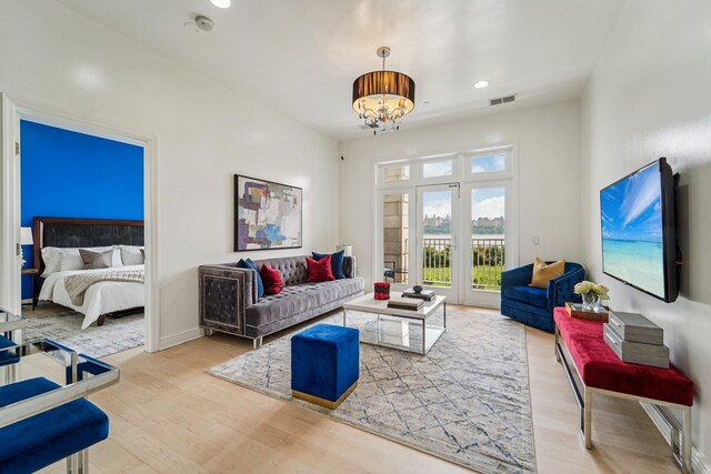7400 River Rd Unit 114, North Bergen, NJ 07047 - living area featuring wood finished floors, a chandelier, and recessed lighting