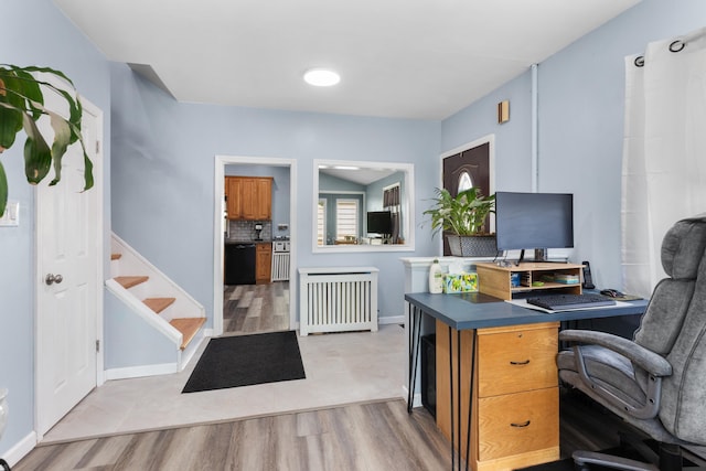 office area featuring radiator heating unit and light wood finished floors