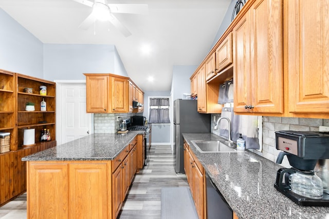 kitchen with decorative backsplash, ceiling fan, stainless steel gas range oven, a sink, and dishwasher