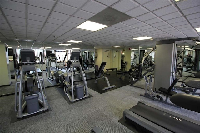 workout area featuring a paneled ceiling