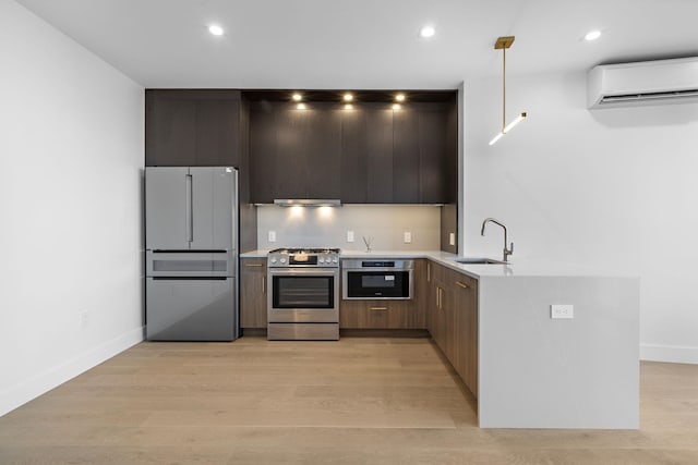 391 1st St Unit 4-C, Jersey City, NJ 07302 - kitchen featuring appliances with stainless steel finishes, a wall mounted AC, modern cabinets, light countertops, and recessed lighting