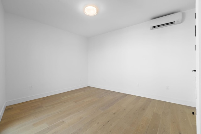 391 1st St Unit 4-C, Jersey City, NJ 07302 - spare room featuring a wall mounted AC and light wood-style floors