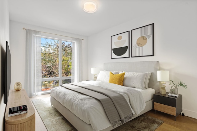 391 1st St Unit 4-C, Jersey City, NJ 07302 - bedroom featuring wood finished floors and baseboards