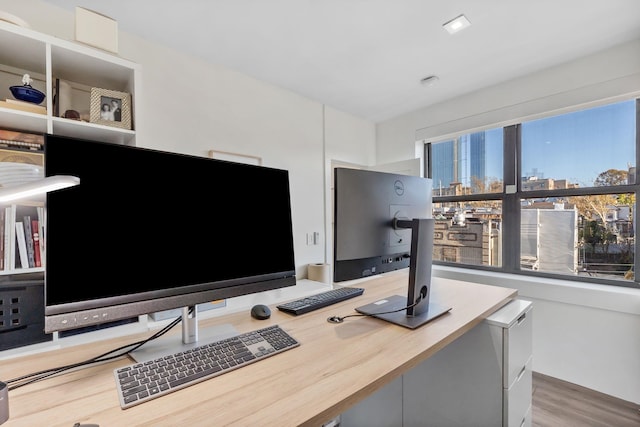 office space with wood finished floors