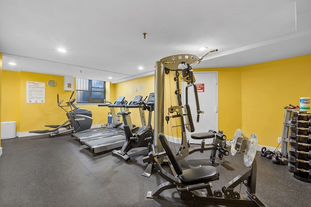 workout area with baseboards and recessed lighting