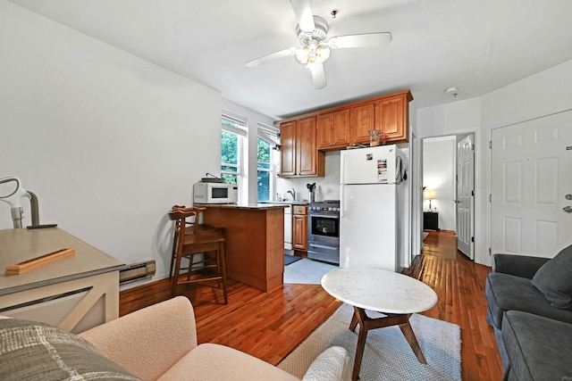 734 Adams St Unit 4B, Hoboken, NJ 07030 - living area featuring a ceiling fan and dark wood-style floors