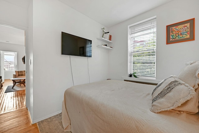 734 Adams St Unit 4B, Hoboken, NJ 07030 - bedroom with light wood-type flooring and baseboards