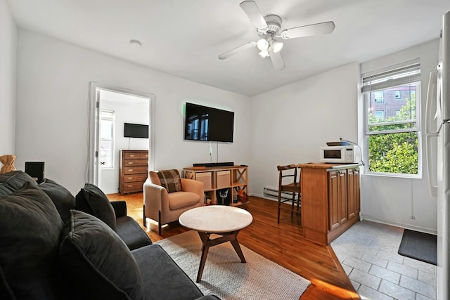 734 Adams St Unit 4B, Hoboken, NJ 07030 - living room with a baseboard radiator and a ceiling fan