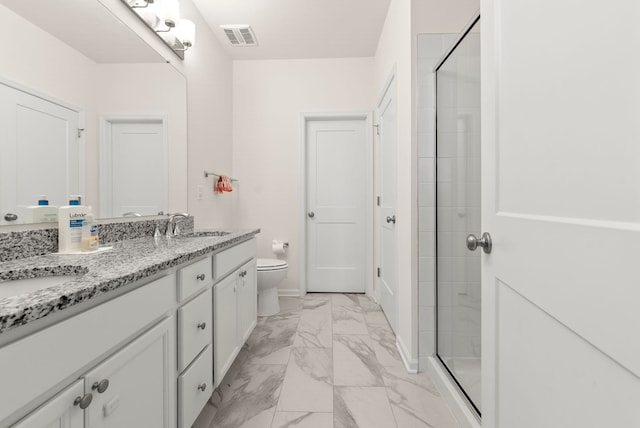 bathroom featuring marble finish floors, toilet, vanity, and tiled shower