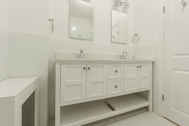 bathroom featuring tile walls and vanity