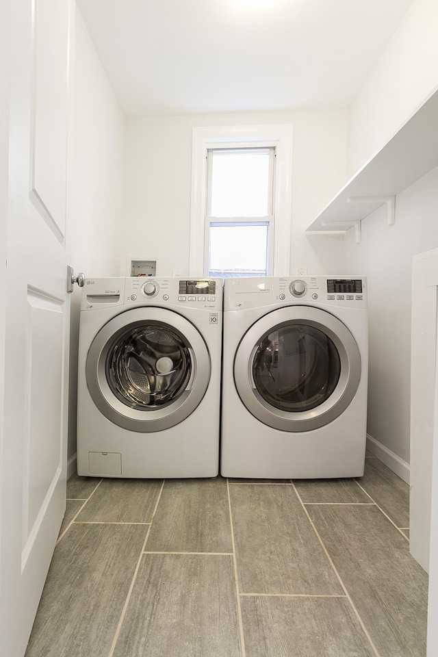 clothes washing area featuring washing machine and clothes dryer