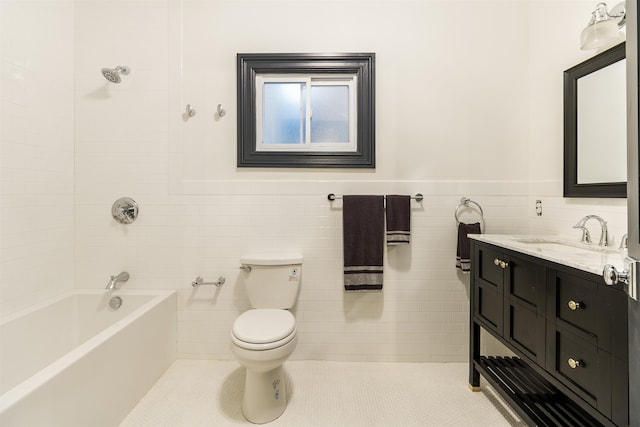 full bathroom featuring tile walls, shower / bath combination, vanity, and toilet