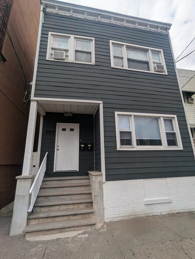 view of front of property featuring cooling unit