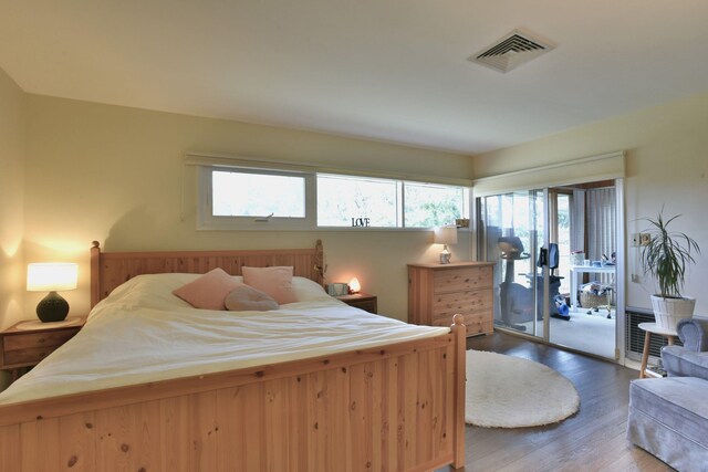 87 Stony Ridge Dr, Hillsdale, NJ 07642 - bedroom with access to exterior, visible vents, and wood finished floors