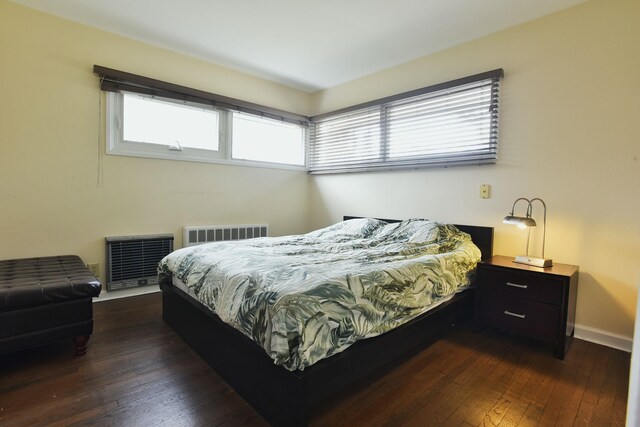 87 Stony Ridge Dr, Hillsdale, NJ 07642 - bedroom with heating unit, dark wood-style floors, baseboards, and visible vents
