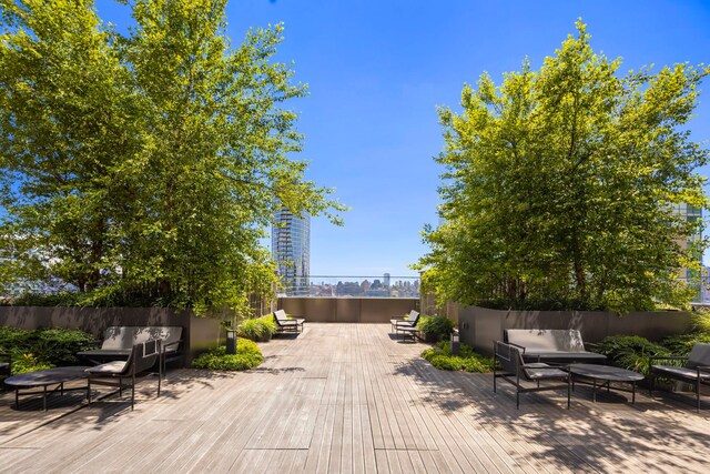 75 Park Ln S Unit 706, Jersey City, NJ 07310 - wooden deck featuring outdoor lounge area