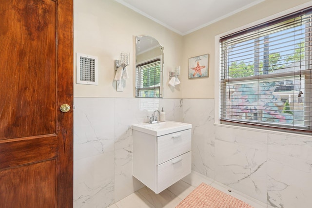 5 77th St, North Bergen, NJ 07047 - bathroom featuring vanity, tile walls, crown molding, and a wainscoted wall
