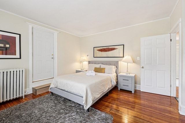 5 77th St, North Bergen, NJ 07047 - bedroom with radiator, wood-type flooring, and crown molding