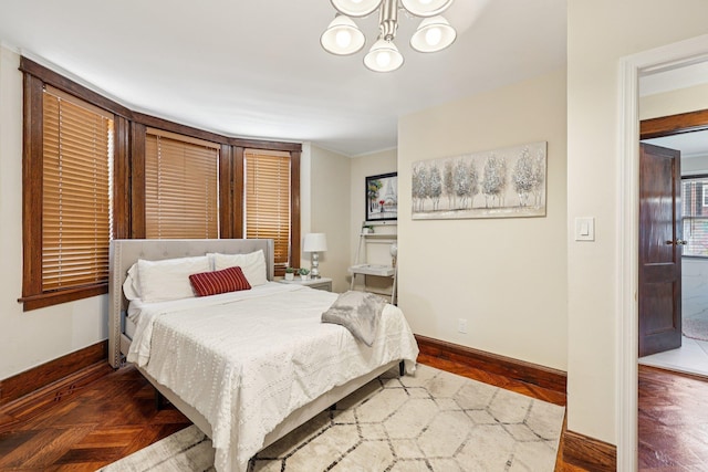 5 77th St, North Bergen, NJ 07047 - bedroom with a chandelier and baseboards