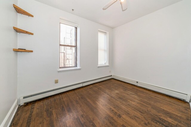 297 Pavonia Ave Unit 2A, Jersey City, NJ 07302 - unfurnished room with baseboard heating, wood finished floors, and healthy amount of natural light