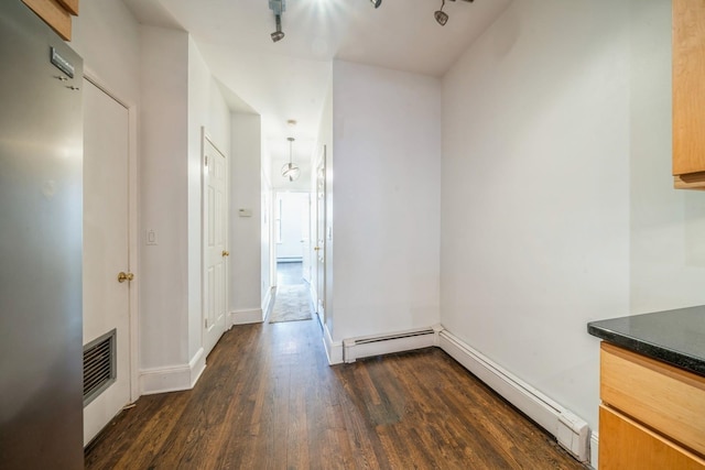 297 Pavonia Ave Unit 2A, Jersey City, NJ 07302 - corridor with dark wood finished floors, a heating unit, baseboards, and a baseboard radiator