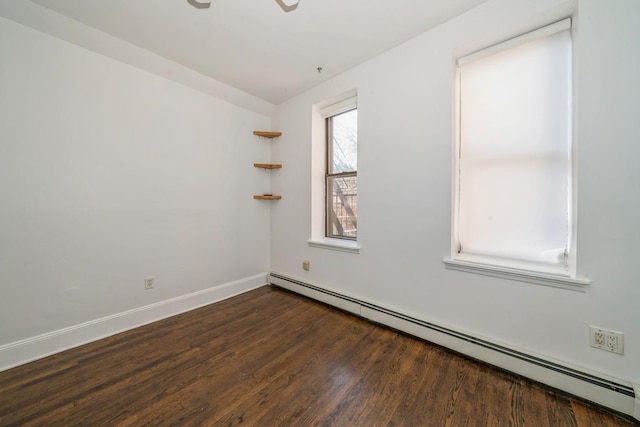 297 Pavonia Ave Unit 2A, Jersey City, NJ 07302 - spare room featuring baseboard heating, wood finished floors, and baseboards
