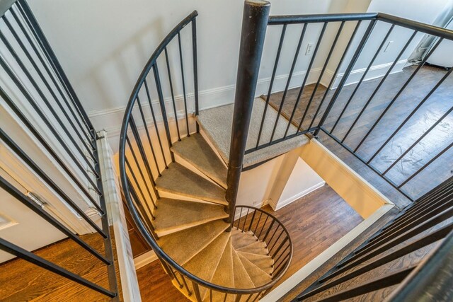 297 Pavonia Ave Unit 2A, Jersey City, NJ 07302 - staircase featuring wood finished floors and baseboards