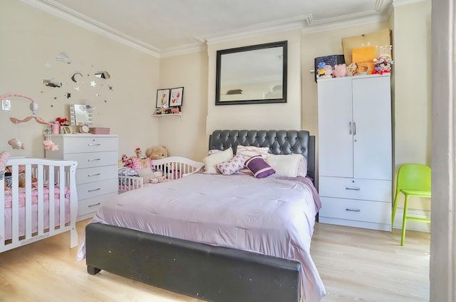 400 67th St, West New York, NJ 07093 - bedroom with light wood finished floors and ornamental molding