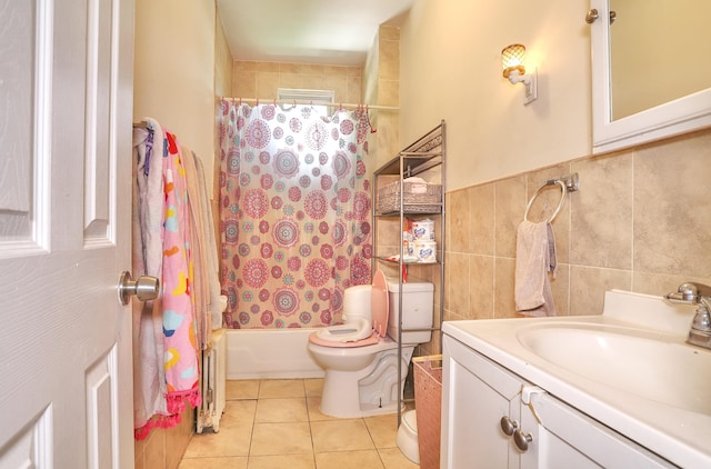 400 67th St, West New York, NJ 07093 - full bathroom with toilet, tile walls, tile patterned flooring, vanity, and shower / tub combo