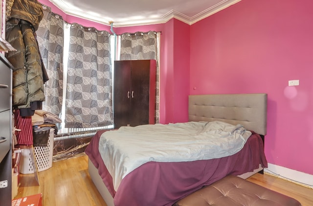 400 67th St, West New York, NJ 07093 - bedroom with wood finished floors and ornamental molding
