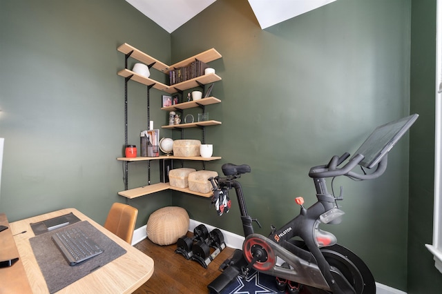 office space featuring baseboards and wood finished floors