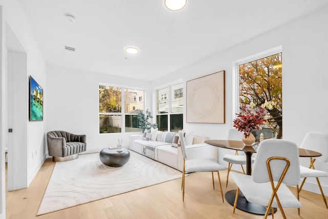 interior space featuring light wood finished floors and visible vents