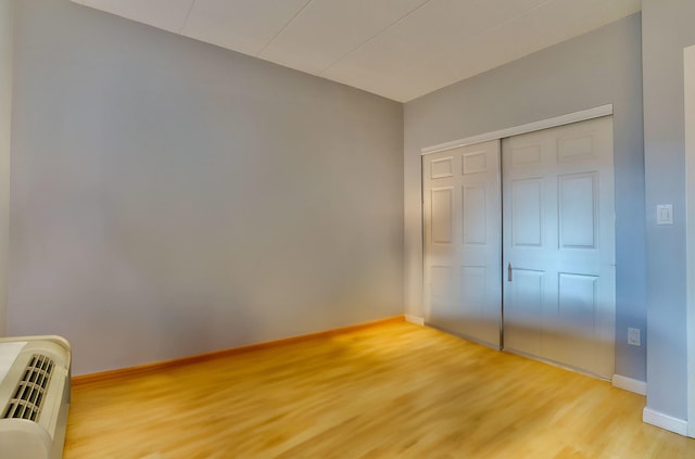 463 1st St Unit 3B, Hoboken, NJ 07030 - unfurnished bedroom featuring light wood-style floors, baseboards, and a closet