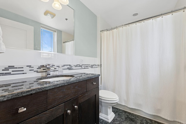 full bathroom with toilet, vanity, and decorative backsplash