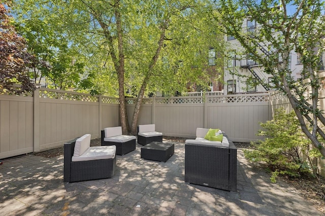 view of patio with a fenced backyard and outdoor lounge area