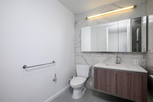 160 1st St Unit 1013, Jersey City, NJ 07302 - bathroom with vanity, tile walls, and tile patterned flooring