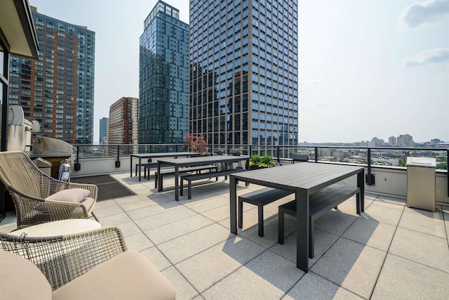 160 1st St Unit 1013, Jersey City, NJ 07302 - view of patio / terrace with a view of skyline, outdoor dining space, and grilling area
