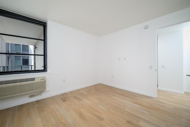 160 1st St Unit 1013, Jersey City, NJ 07302 - unfurnished room with wood finished floors and a wall mounted AC
