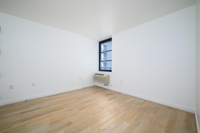 160 1st St Unit 1013, Jersey City, NJ 07302 - unfurnished room with light wood finished floors and a wall mounted air conditioner