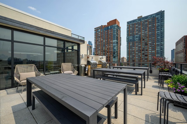 160 1st St Unit 1013, Jersey City, NJ 07302 - view of patio with outdoor dining area, a view of city, and exterior kitchen