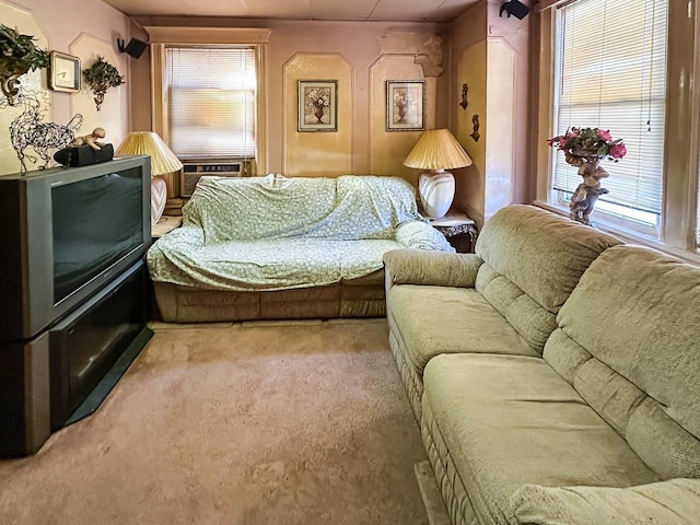 interior space featuring carpet, plenty of natural light, and cooling unit