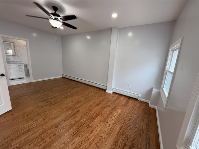 187 Lembeck Ave, Jersey City, NJ 07305 - unfurnished room featuring baseboard heating, a ceiling fan, wood finished floors, and a baseboard radiator