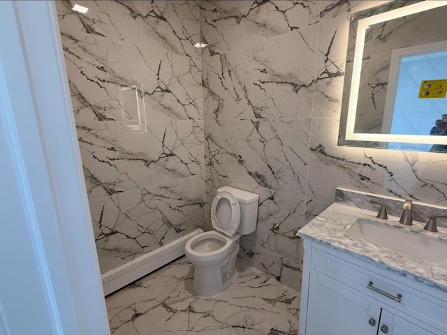 187 Lembeck Ave, Jersey City, NJ 07305 - bathroom featuring a baseboard heating unit, vanity, marble finish floors, and tile walls