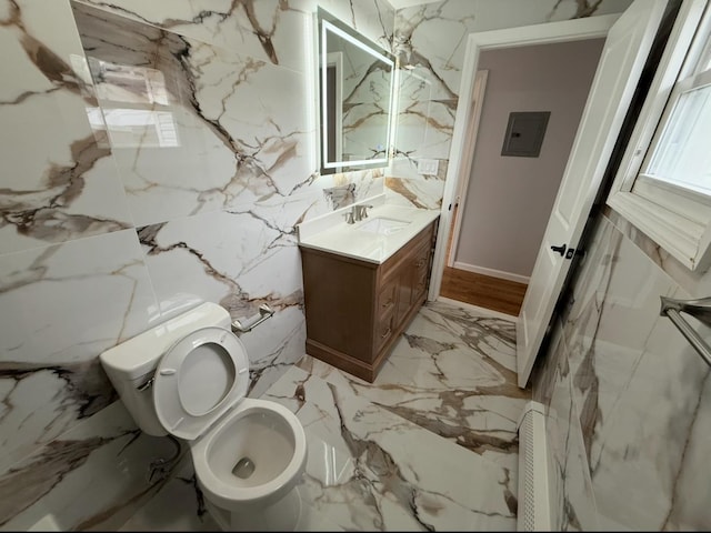 187 Lembeck Ave, Jersey City, NJ 07305 - bathroom featuring vanity, marble tiled floors, and electric panel