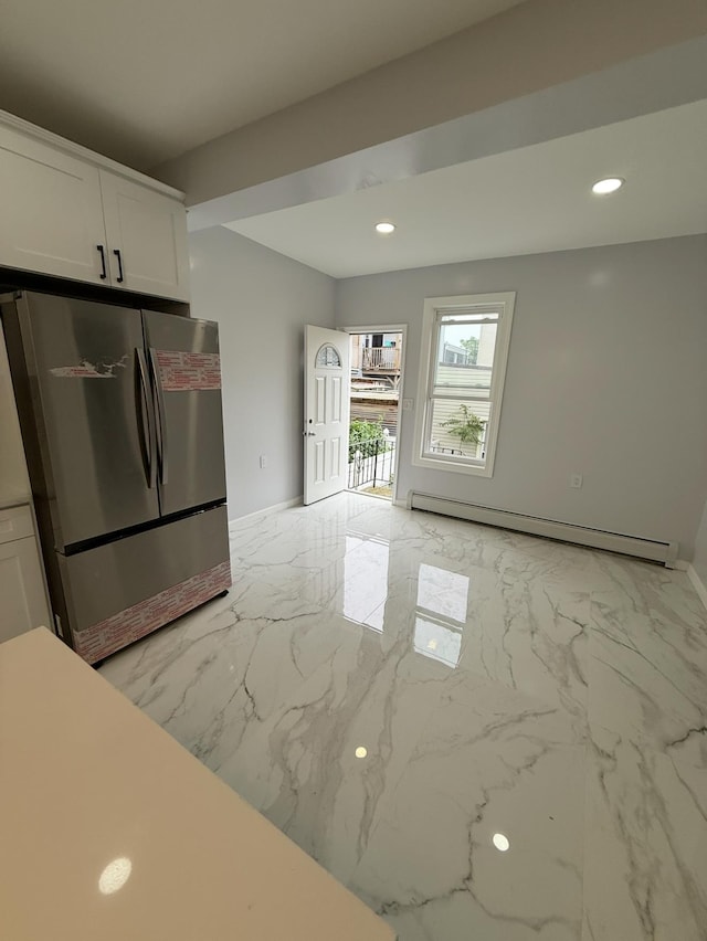 187 Lembeck Ave, Jersey City, NJ 07305 - kitchen with freestanding refrigerator, a baseboard radiator, light marble finish floors, recessed lighting, and white cabinetry