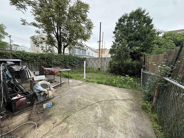 125 W 3rd St, Bayonne, NJ 07002 - fenced backyard with a patio area