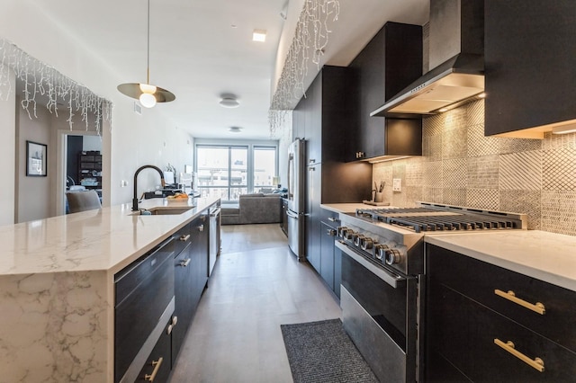 202 Merseles St Unit 504, Jersey City, NJ 07302 - kitchen with appliances with stainless steel finishes, wall chimney exhaust hood, dark cabinetry, decorative backsplash, and open floor plan