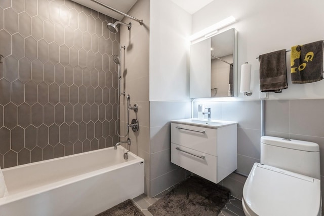202 Merseles St Unit 504, Jersey City, NJ 07302 - bathroom with tile walls, pet washing area, vanity,  shower combination, and tile patterned floors